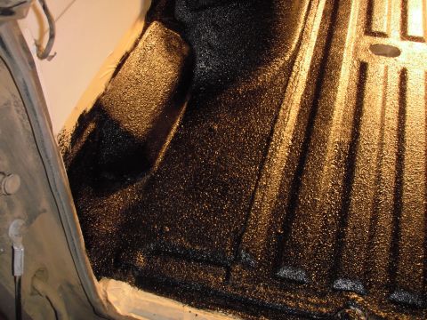 1993 Ford Bronco - Close-up of a truck bed liner, showing its textured surface and ribbed construction.