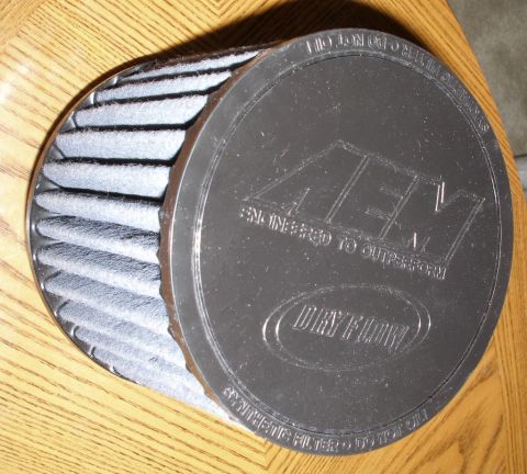 2010 Hyundai Genesis - Close-up of an AEM Dry Flow air filter, showing its construction and branding.