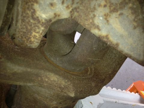 1979 Ford Bronco - This image shows a close-up of a heavily rusted metal component, likely a vehicle part, with no clear identifying features.
