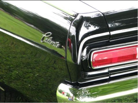 1966 Mercury Comet - Close-up of the rear quarter panel on a black 1966 Mercury Comet Caliente.