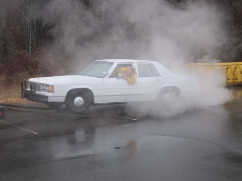 1991 Ford Crown Victoria LTD - White 1991 Ford Crown Victoria LTD is seen from the side, producing a large amount of smoke.