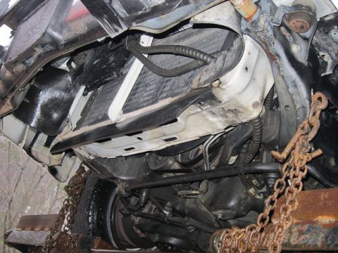 1991 Ford Crown Victoria LTD - Underside view of a 1991 Ford Crown Victoria LTD, focusing on the radiator and front suspension components.