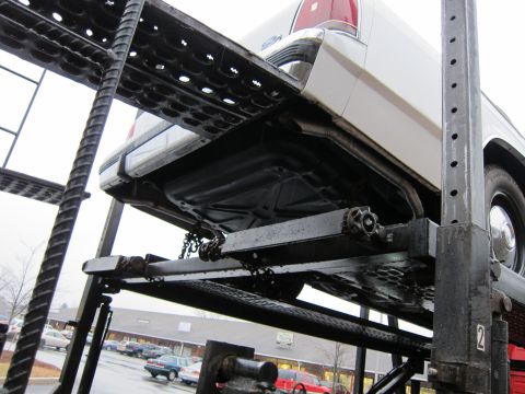 1991 Ford LTD Crown Victoria - Rear view of a 1991 Ford Crown Victoria LTD being transported on a car carrier.