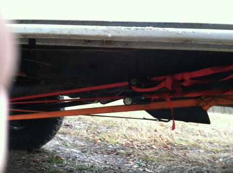 1996 Ford Bronco - Straps are used to secure the underside of this vehicle.