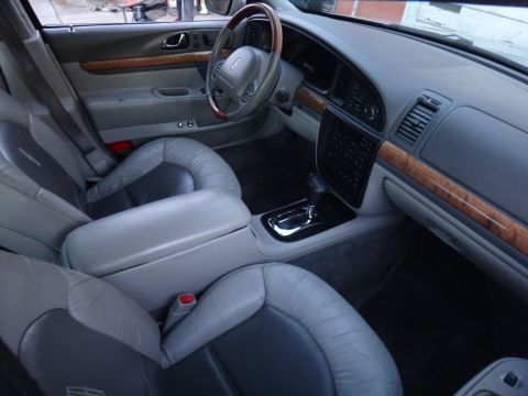 2000 Lincoln Continental - Front interior view of a 2000 Lincoln Continental, leather seats and wood trim.