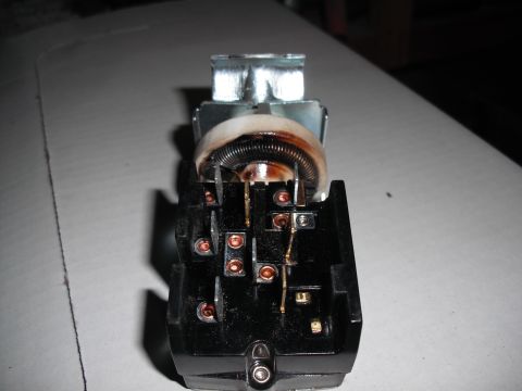 1968 Ford Bronco - This is a close-up view of the electrical connector and terminals on a vehicle's headlight switch.