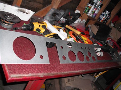 1968 Ford Bronco - A custom metal dashboard panel is shown with various gauge cutouts, alongside a drill and other tools.