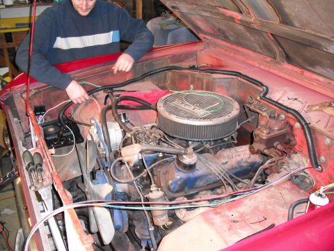 1968 Ford Bronco - Working on the wiring in the engine bay of a 1968 Ford Bronco. Aftermarket air cleaner is installed.