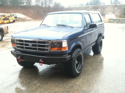 1996 Ford Bronco - This blue 1996 Ford Bronco features an aftermarket bumper and off-road tires.