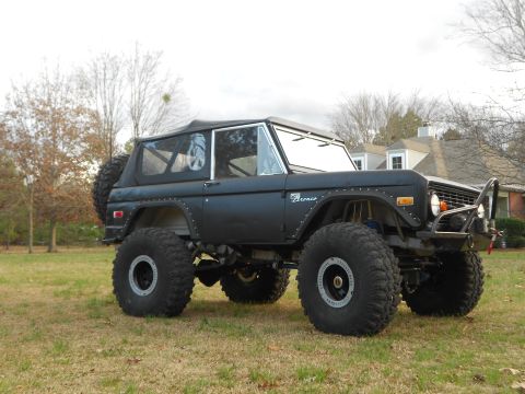 1967 Ford Mustang - This lifted Ford Bronco features oversized tires and a spare tire mounted on the rear.