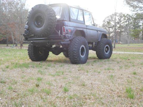 1967 Ford Mustang - This modified Ford Bronco features oversized tires and a spare tire mounted on the rear carrier.