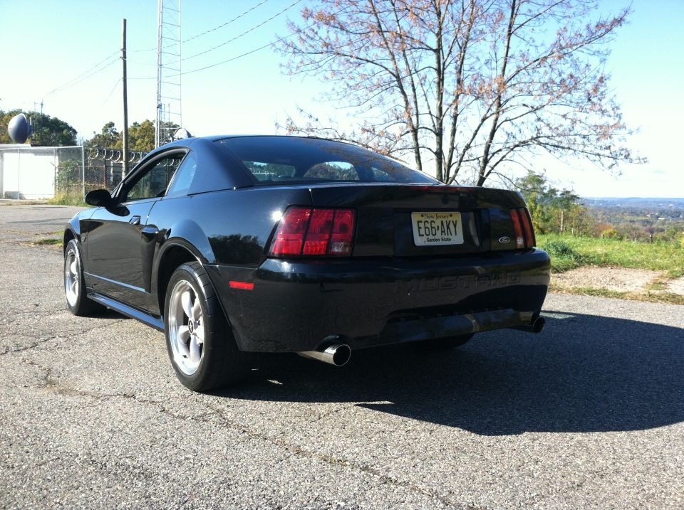 Black Ford Mustang rear passenger side view with New Jersey license plate E66-AKY.