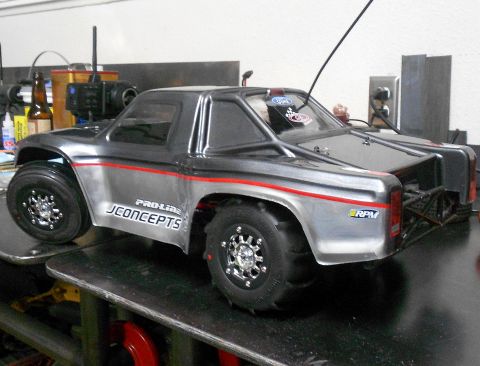 1996 Ford Bronco - This RC car features Pro-Line JConcepts branding and an RPM sticker on its silver and black body.