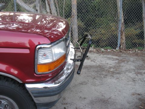 1995 Ford F-150 - Front view of a red 1995 Ford F-150 pickup truck equipped with a light bar.