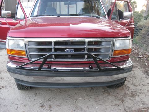1995 Ford F-150 - Front view of a red 1995 Ford F-150 pickup truck with a brush guard installed.
