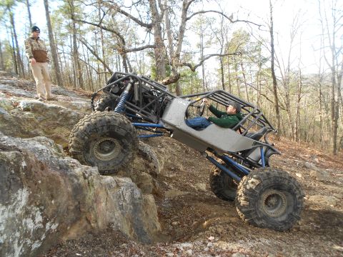 1967 Ford Mustang - A custom-built buggy navigates a rocky trail with a person watching.