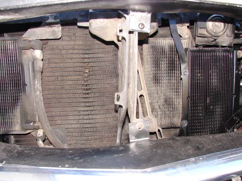 1973 Ford Ranchero - Close-up view of the front of a vehicle's engine bay, showing the radiator and transmission cooler.
