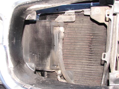 1973 Ford Ranchero - Close-up view of a transmission cooler mounted in front of the vehicle's radiator.