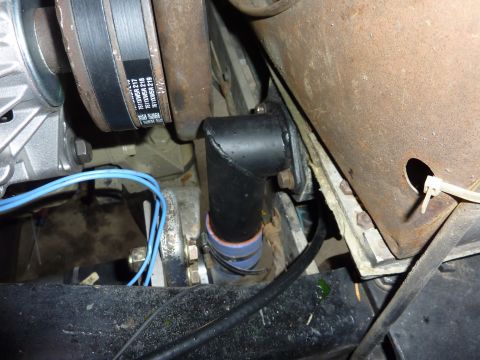 1959 Kenworth W900A - Engine bay detail showing a hose adapter, wiring, and a belt-driven component.