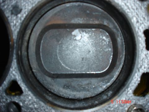 1995 Ford Bronco - Close-up view of an engine cylinder, showing wear and deposits. The registry claims it is a 1995 Ford Bronco engine part.