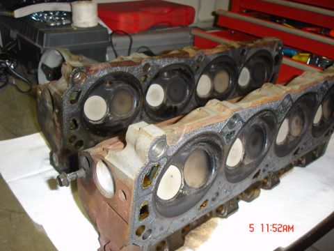 1995 Ford Bronco - Two engine cylinder heads are shown, likely removed for repair or replacement.