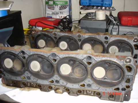 1995 Ford Bronco - Engine cylinder heads are shown, with multiple valves visible in each cylinder bore.
