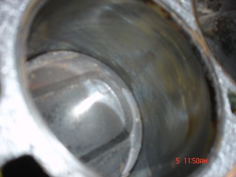 1995 Ford Bronco - Engine cylinder bore detail, showing internal wear and discoloration.