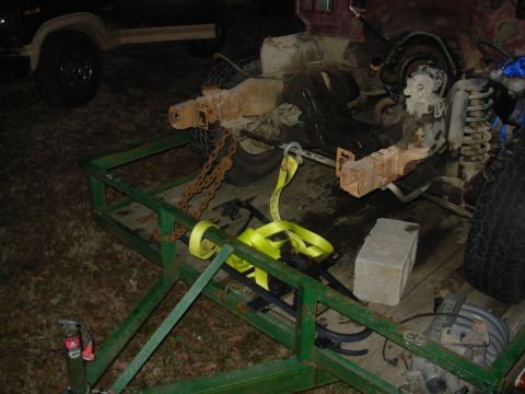 1983 Ford Bronco - It was getting too late to be delicate, so I decided to just shove it off the trailer. The strap will keep it from rolling down into the cr…
