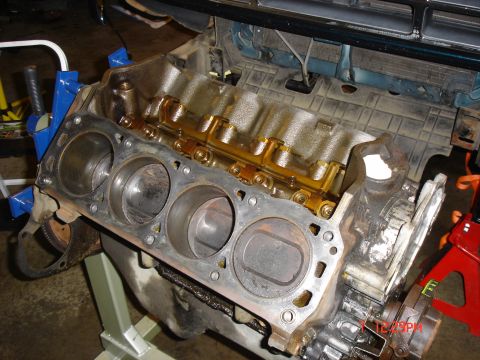 1995 Ford Bronco - Close-up of an engine block, showing the cylinders and internal lubrication system.