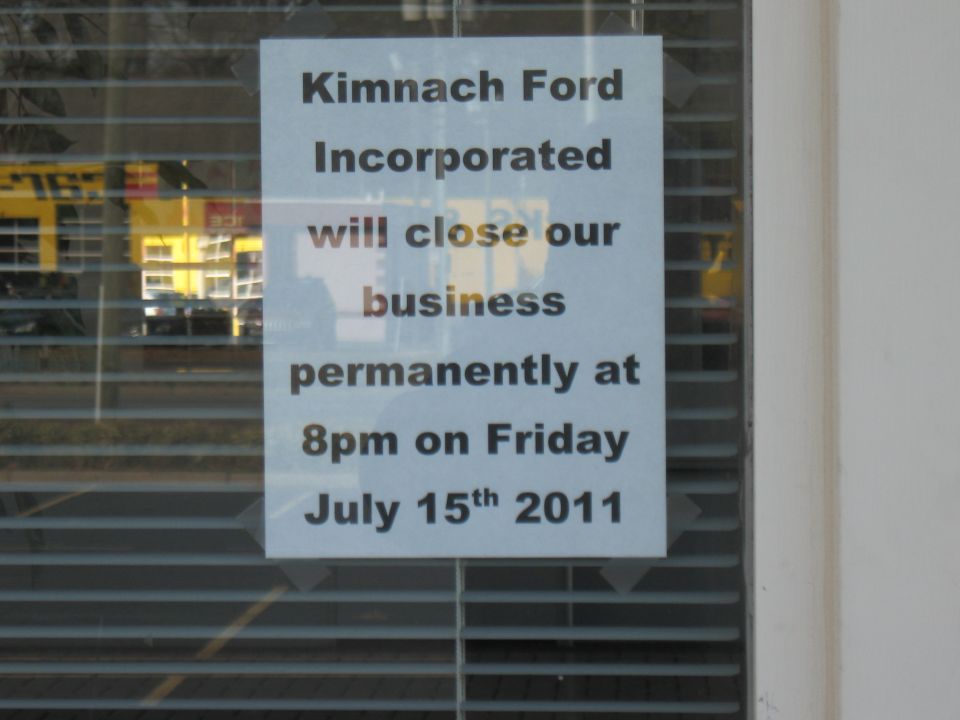 Sign announcing Kimnach Ford will close business permanently on July 15th, 2011