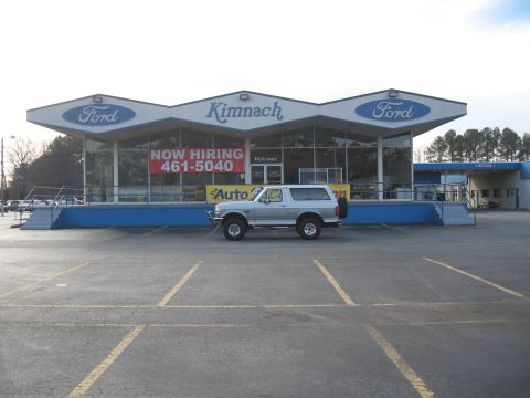 1968 Shelby GT500 - Kimnach Ford dealership with a silver Ford Bronco parked outside. A 'NOW HIRING' banner is displayed.