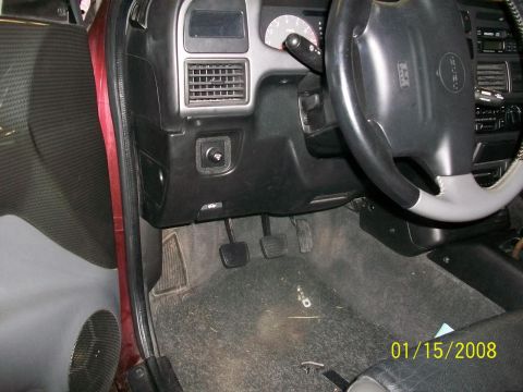 2000 Isuzu Vehicross - The interior of a 2000 Isuzu Vehicross is visible, the dashboard, steering wheel, and pedals.