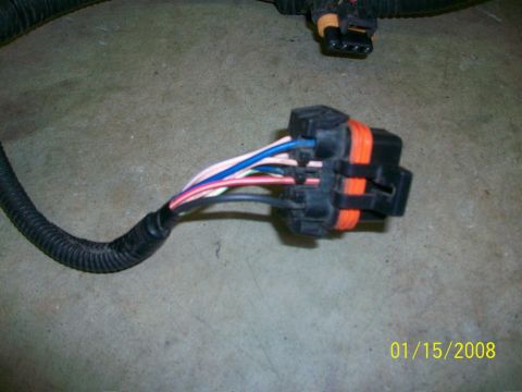 2000 Isuzu Vehicross - A close-up view of a vehicle's wiring harness connector with multiple colored wires.