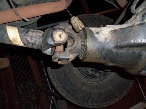 1989 Ford Bronco - Close-up of a vehicle's rear axle and driveshaft components.