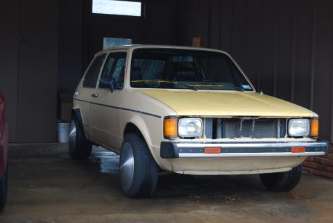 1983 Volkswagen Rabbit - This 1983 Volkswagen Rabbit is parked inside a garage with its front grille removed.