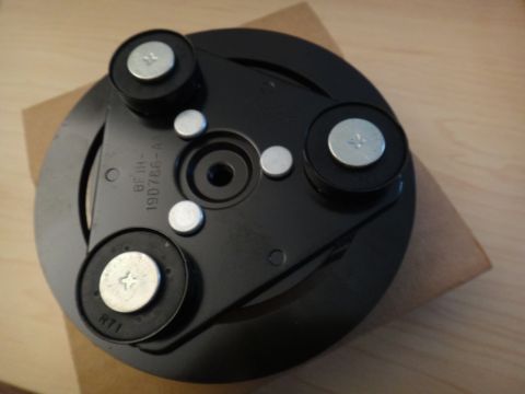 2003 Ford Taurus - AC clutch hub assembly, part number 190786-A1, shown on a wooden surface.