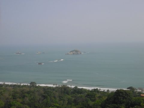 1993 Ford Bronco - A wide view of the ocean with several small islands and a coastline with trees.