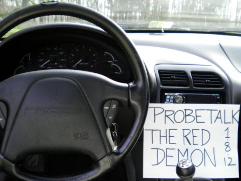 1997 Ford Probe - Interior view of a 1997 Ford Probe, a handwritten sign on the dashboard.