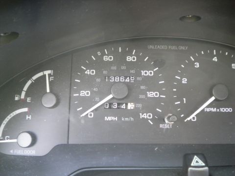 1997 Ford Probe - Close-up of a car's dashboard, showing the speedometer, odometer, and fuel gauge.