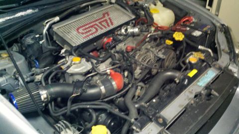 1999 Mercury Grand Marquis - Engine bay with STI intercooler and aftermarket air intake. The registry claims 1999 Mercury Grand Marquis, which is incorrect.