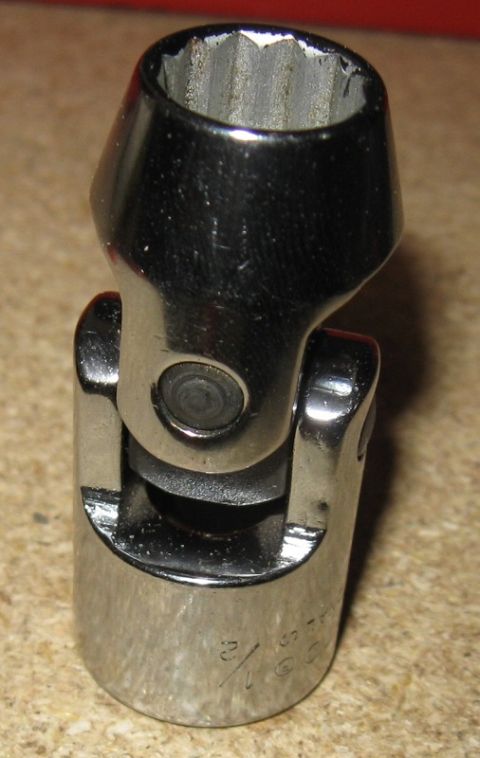 2000 Ford Crown Victoria - Close-up of a chrome universal joint socket adapter, showing its articulated joint and socket end.