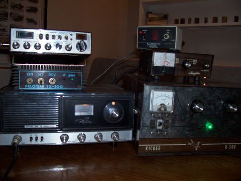 1978 Ford F-150 - A collection of CB radio equipment, including a Palomar TX-300 and a Kicker K-500, is displayed on a wooden surface.