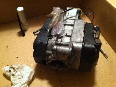 1981 Garelli Rally Sport - A close-up view of a disassembled motorcycle engine, resting on a cardboard surface.