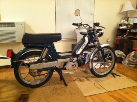 1981 Garelli Rally Sport - This Garelli moped features a green frame with a white stripe on the fuel tank and chrome accents.