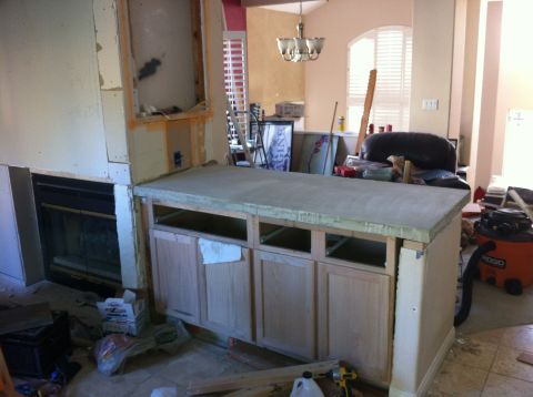 1989 Yugo Cabrio - This image shows a kitchen island in the process of renovation, with exposed framing and unfinished cabinetry.