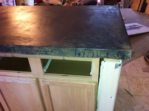 1989 Yugo Cabrio - A partially constructed countertop and cabinet unit is shown in a workshop setting.