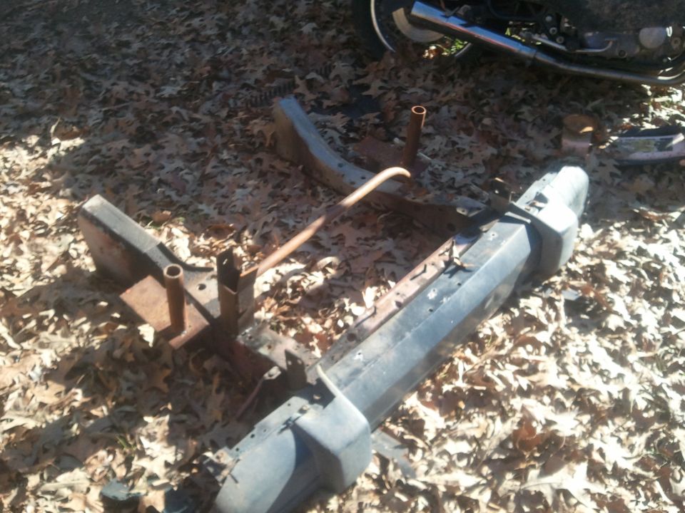 Front bumper and frame parts on the ground