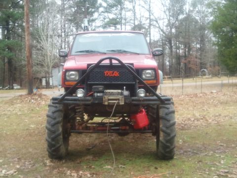 1978 Ford Bronco - This heavily modified Jeep Cherokee XJ sits on massive tires, ready for off-road adventures.