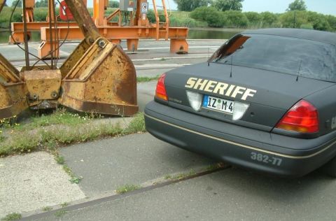2003 Ford Crown Victoria - Rear view of a 2003 Ford Crown Victoria Sheriff car with 'SHERIFF' text on the trunk.