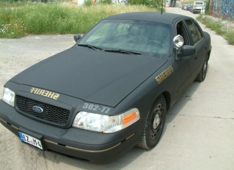 2003 Ford Crown Victoria - This 2003 Ford Crown Victoria is marked as a sheriff's vehicle with "SHERIFF" text on the hood and fender.